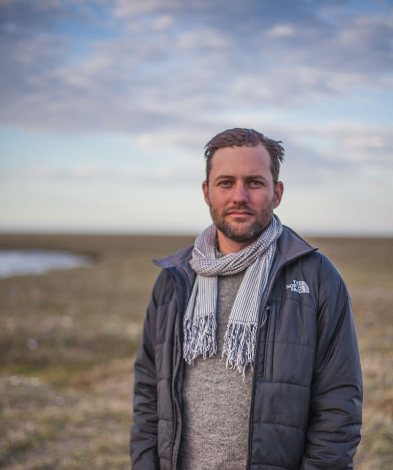 Jason standing in an arctic landscape